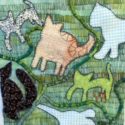 kattsiluetter mot grön bakgrund fritt broderi av Ann Rydh